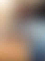 Smiling craftswoman displays handcrafted wooden Christmas trees