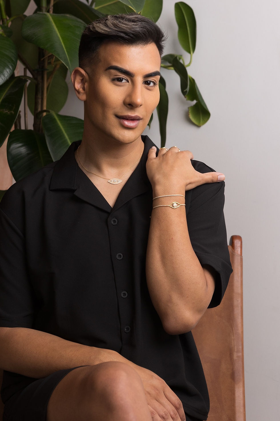 Thumbnail: green blue shirt male model wearing silver jewellery 