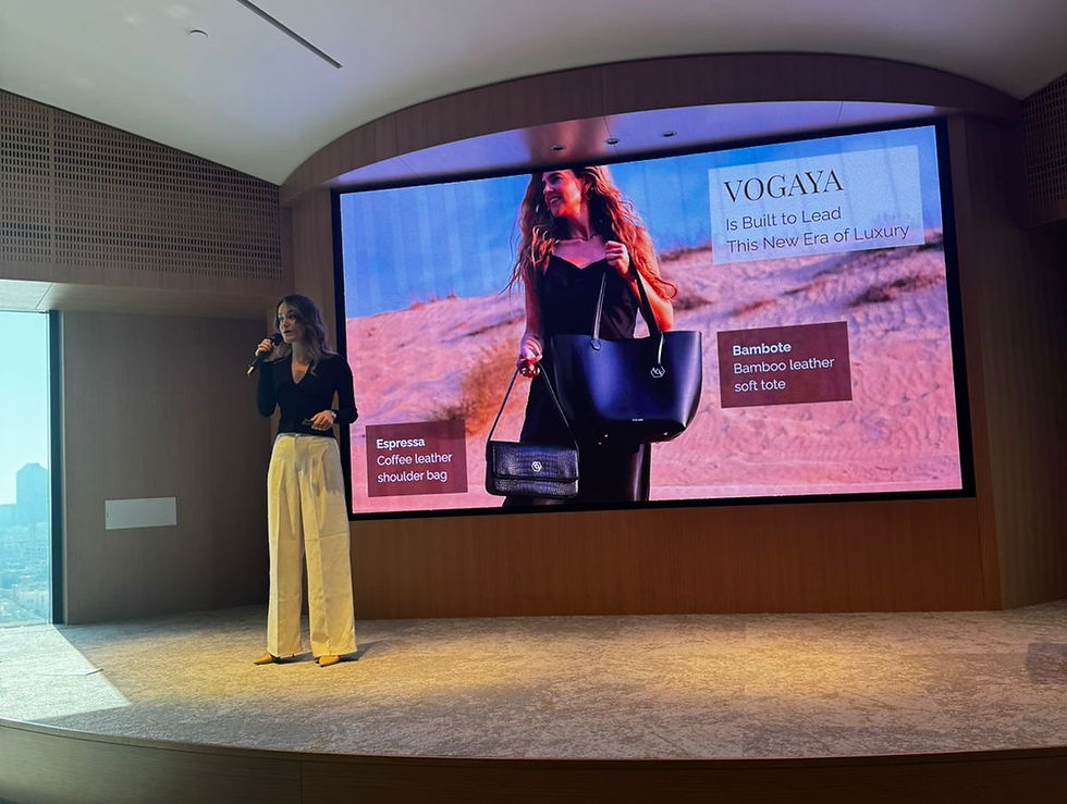 Elke Steijns pitching VOGAYA at the FRWRDx Live event, standing in front of a presentation slide that reads "VOGAYA Is Built to Lead This New Era of Luxury."