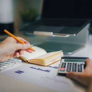 Notebook with unit economics calculations — CAC and LTV — on a clean desk, Dubai entrepreneur