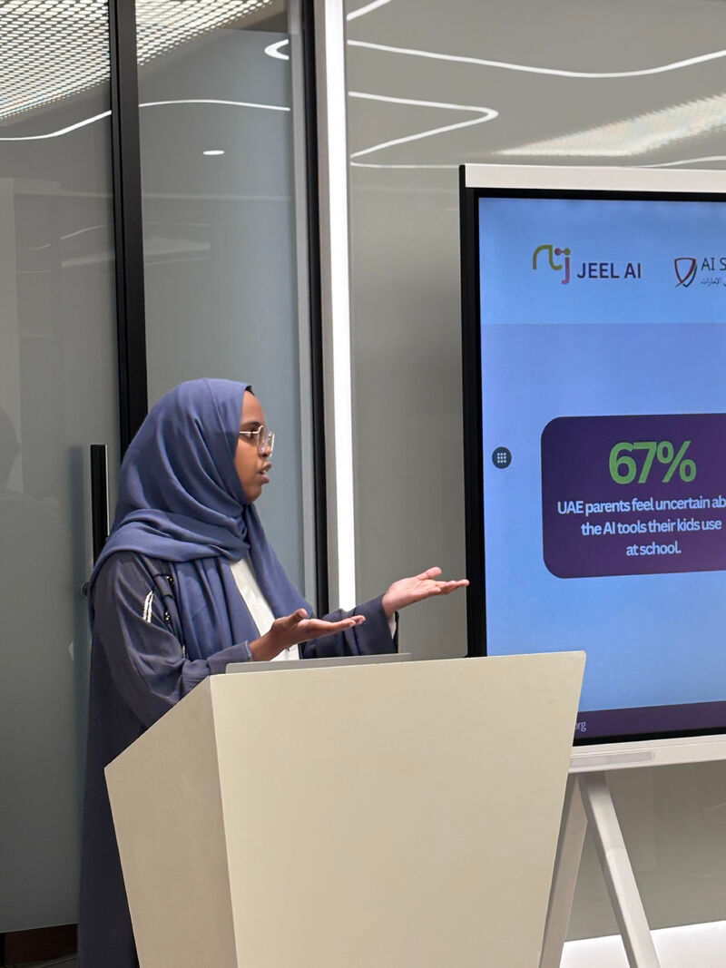 Fatma Egal, founder of Jeel AI, presenting at the AI Safety UAE event in Dubai — Jeel AI slide visible behind her