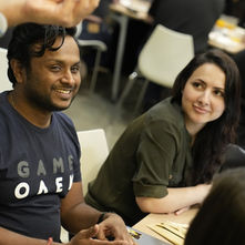 Aditya Pappula at a FRWRDx workshop in Dubai, seated at a table with fellow participants.