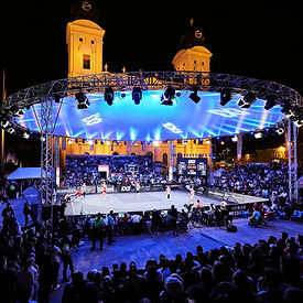 FIBA 3x3 World Tour court in Debrecen, Hungary — packed outdoor arena in the city square with fans and a dynamic vibe.