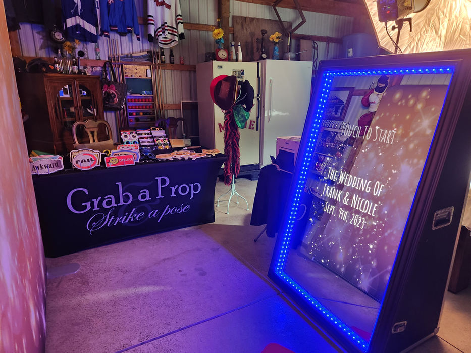 Wedding photo booth with props and backdrop