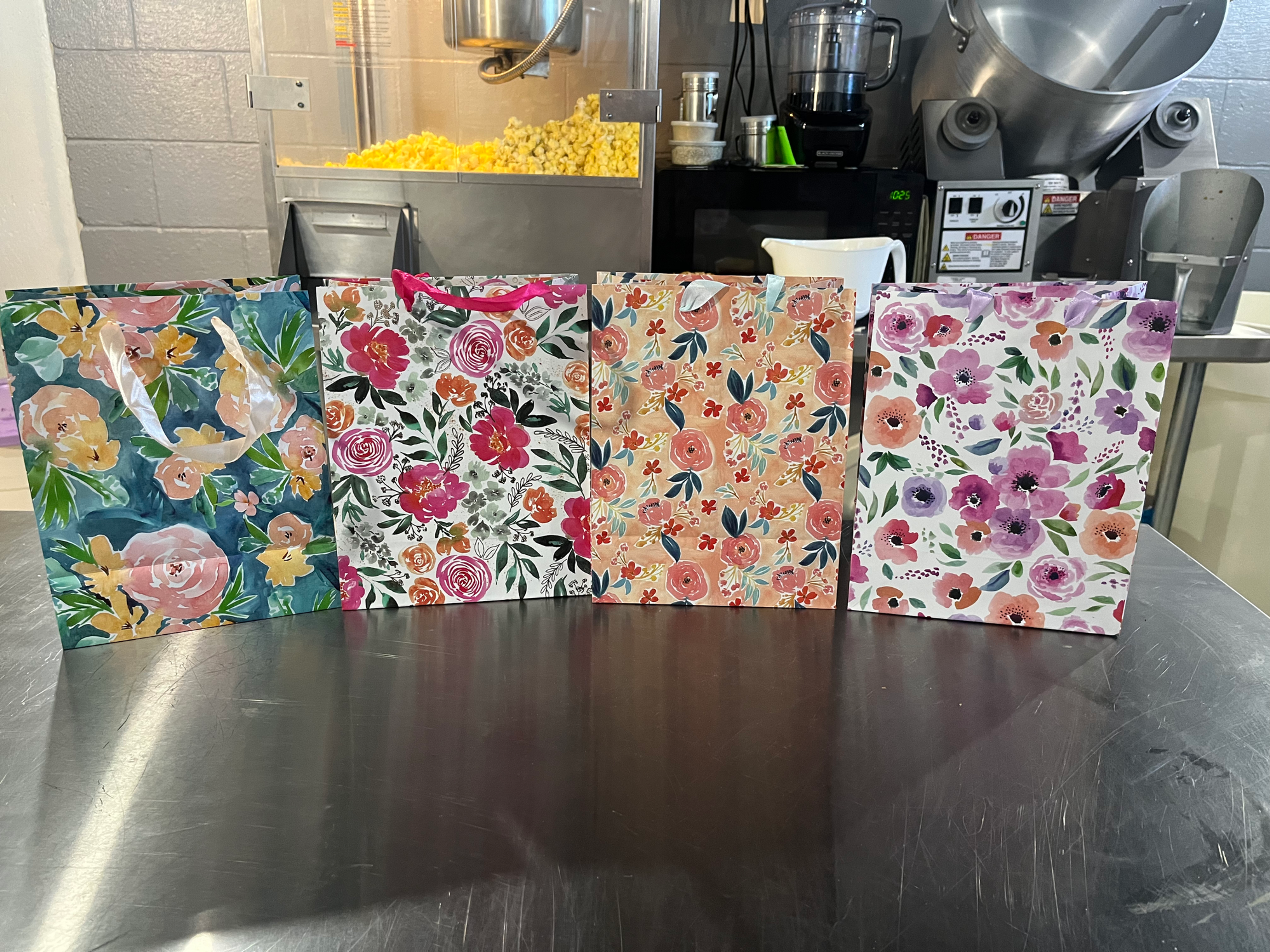 3 Small Bags of Popcorn in Floral Gift Bag