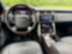 Close-up view of luxury SUV interior with leather seats and digital dashboard