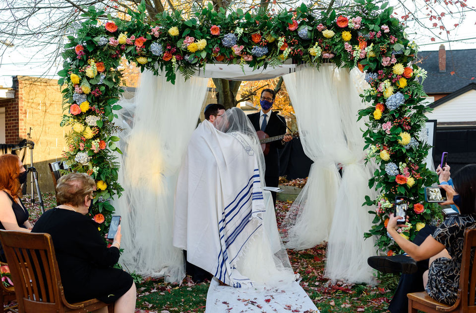 couple sharing a wedding kiss
