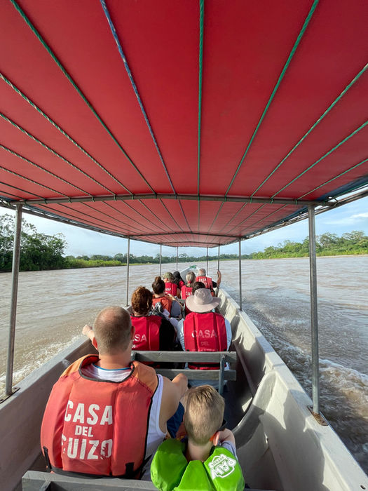 people in boat on river