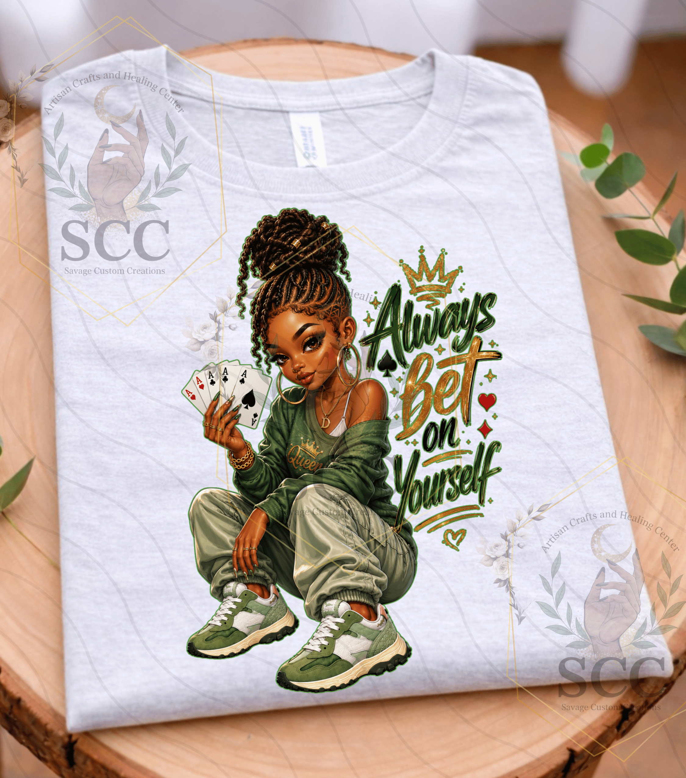 African American Woman with text 'Always Bet On Yourself" on a grey shirt, holding playing cards