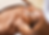 A relaxed woman enjoying a luxurious facial by a skincare specialist in a serene spa environment