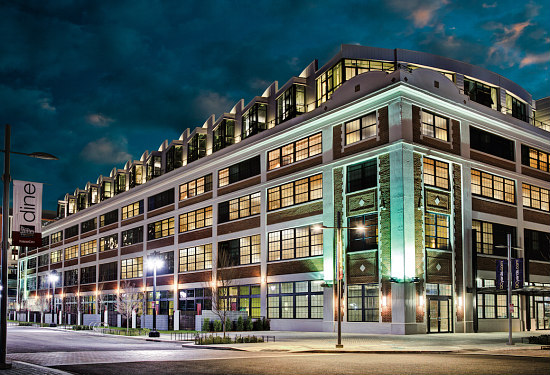 The Foundry Lofts at the Yard exterior view of building at night time