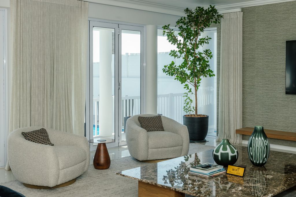 Modern living room with swivel chairs and marble table