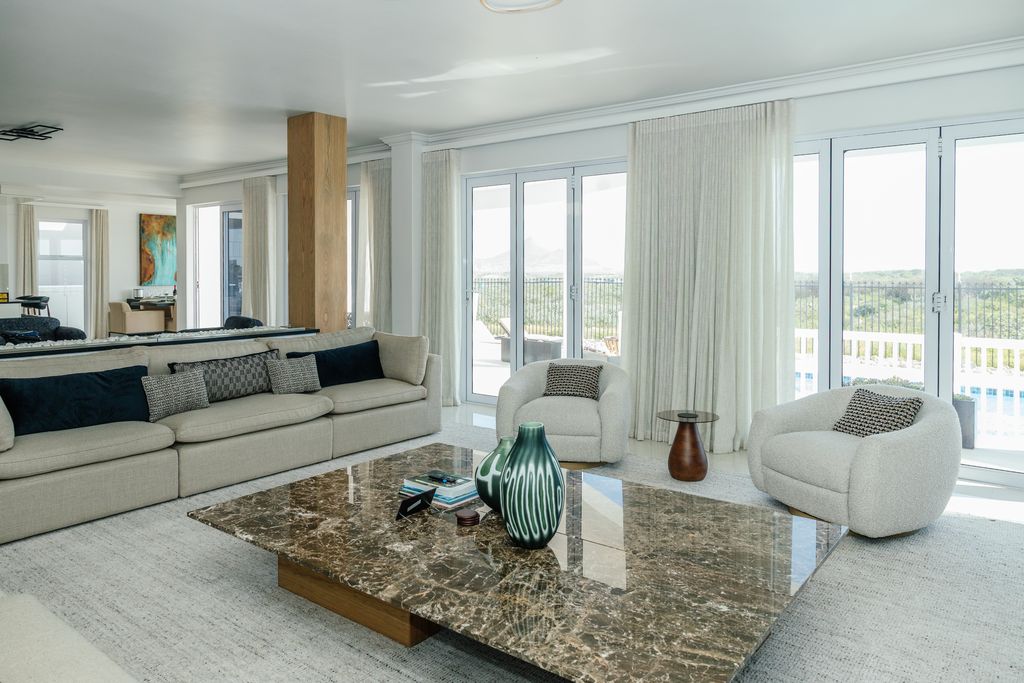 Modern living room with marble coffee table and beige sofa