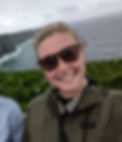 Katie Logan, founder and CEO of Logan Planning Solutions, a micro wedding and elopement planner in Boston, Massachusetts, New England, on a trip to the Cliffs of Moher in Ireland. Katie plans travel and honeymoons for her clients all over the world.
