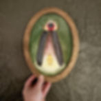 Original firefly watercolor in antique oval frame on dark green wall