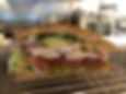 1/2 Turkey Club or 1/2 Stacked BLT + Choice Sidekick