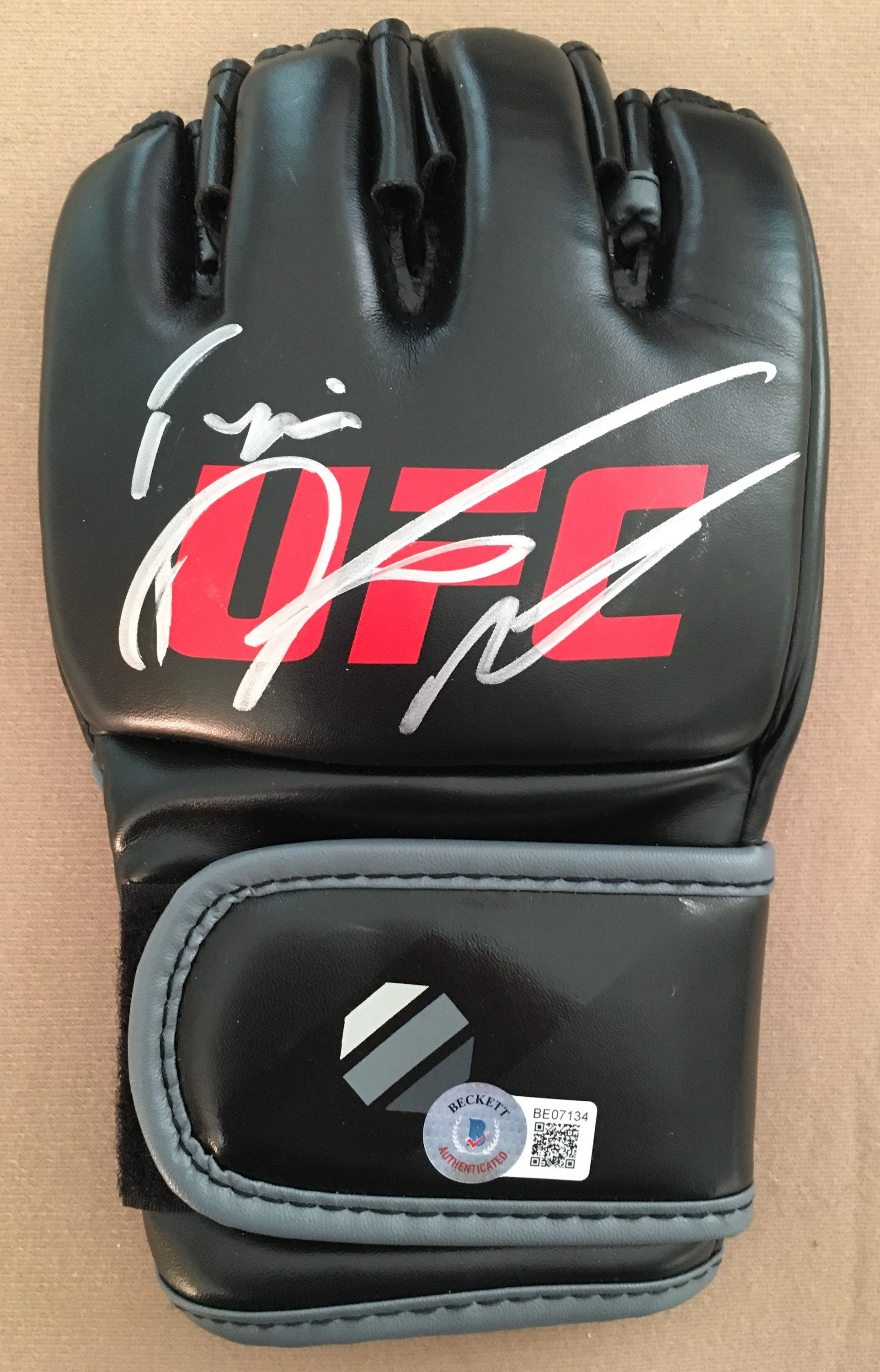 Dustin Poirier Signed UFC Glove with Beckett COA.