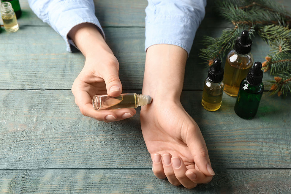 Close-up view of essential oils bottles on wooden shelf