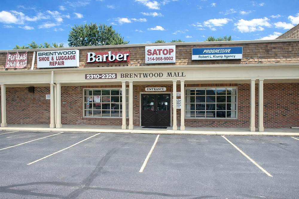 Exterior of Brentwood Mall with businesses, retail for lease