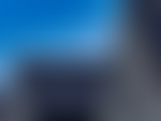 Rows of houses with solar panels on roofs against a clear blue sky. Bright, sunny day highlighting clean energy focus.