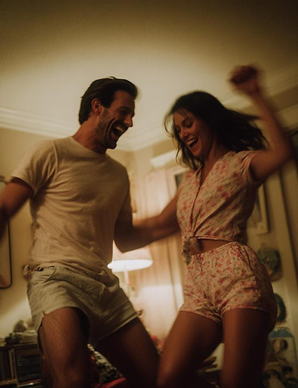 couple jumping on the bed