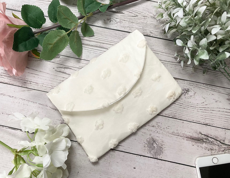 Thumbnail: Ivory funky dotty fabric clutch bag for mobile phone on wedding day