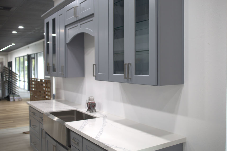 Northwest Cabinet & Floor Showroom of Blue/Grey Cabinets with Glass.