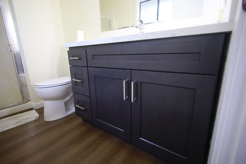Photos from the Bothell Bathroom Renovation with dark oak shaker cabinets and lvp flooring.