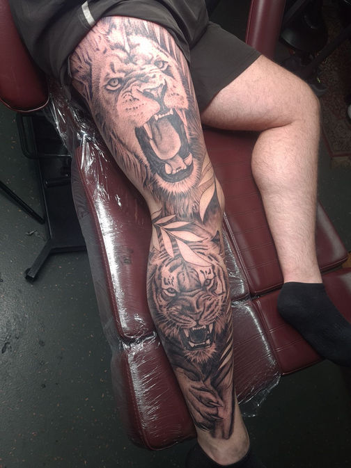 lion/tiger leg sleeve tattoo by liam rebel