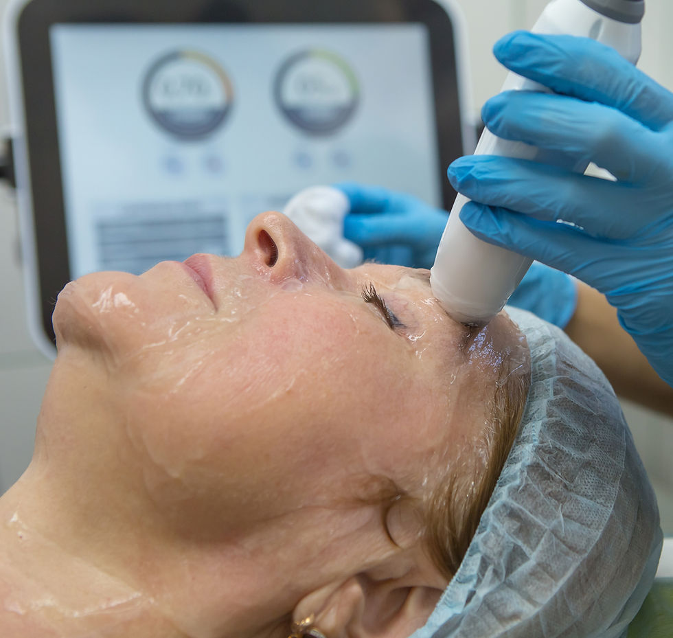 Juvenex Hydrojelly mask application — student preparing to apply a hydrojelly mask under instructor supervision.
