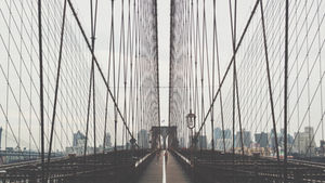 A view as walking over the Brooklyn Bridge.
