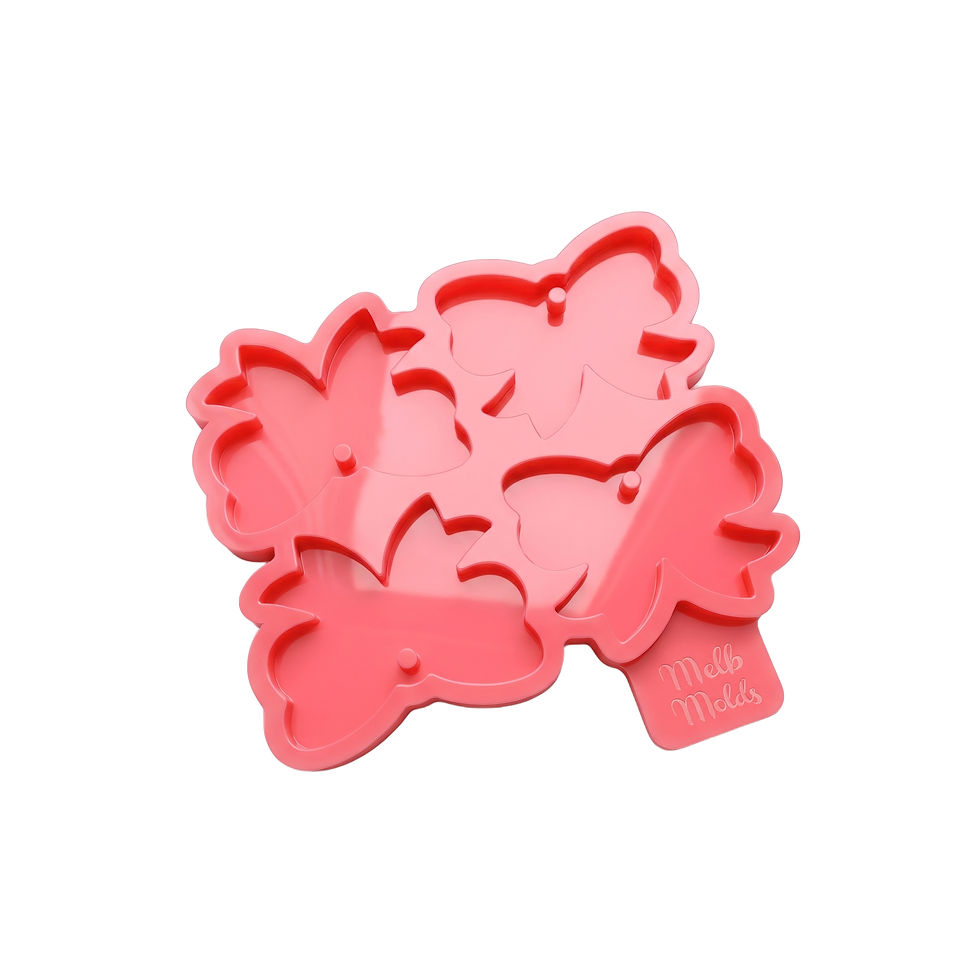 Miniature : Pink silicone mold with four bow-shaped tag cavities and hole-forming pins on a white background.