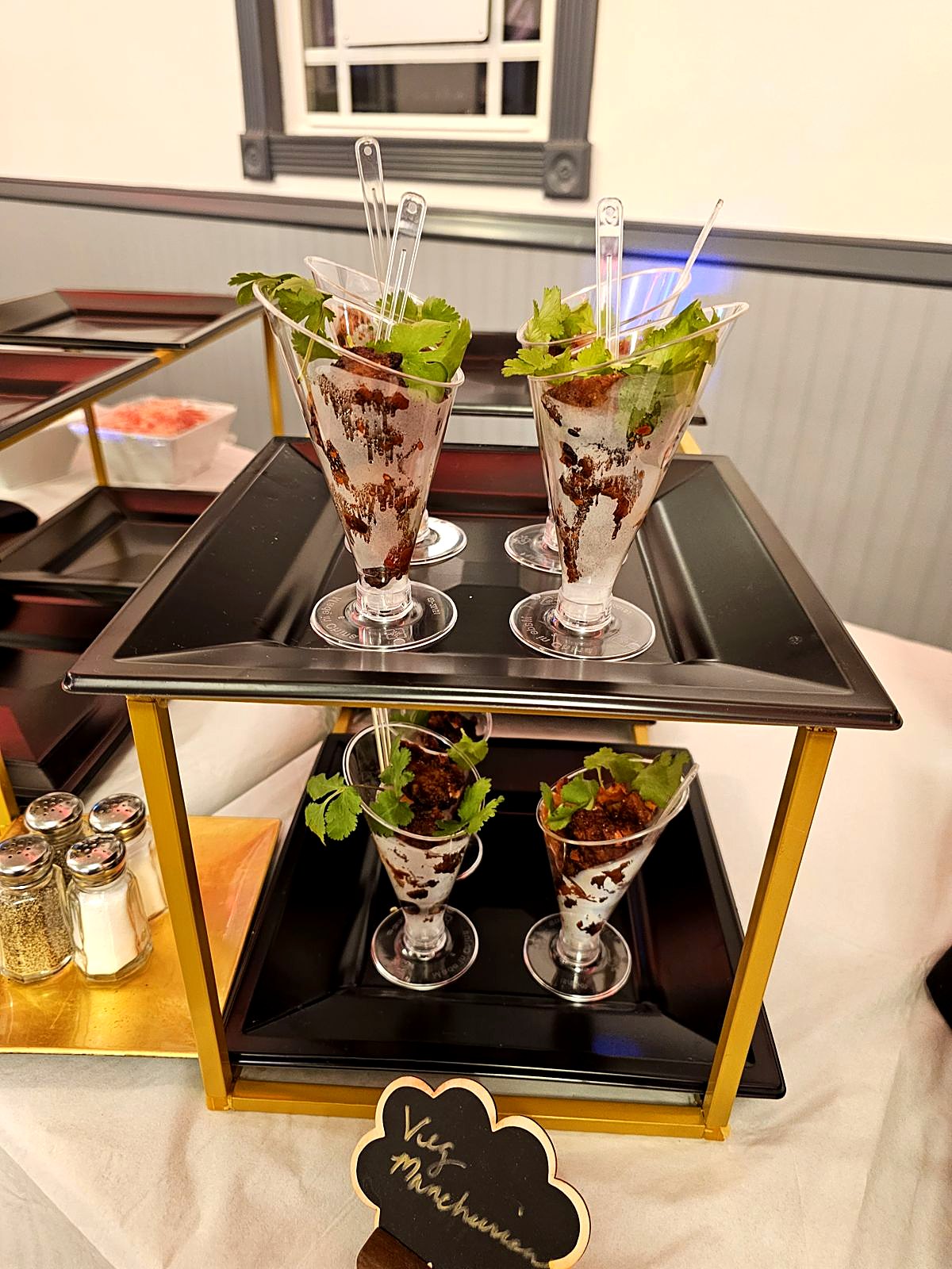 Mousse dessert cups on a gold serving cart