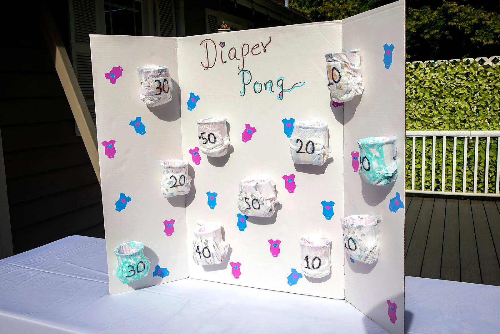 Diaper Pong game board set up on the deck
