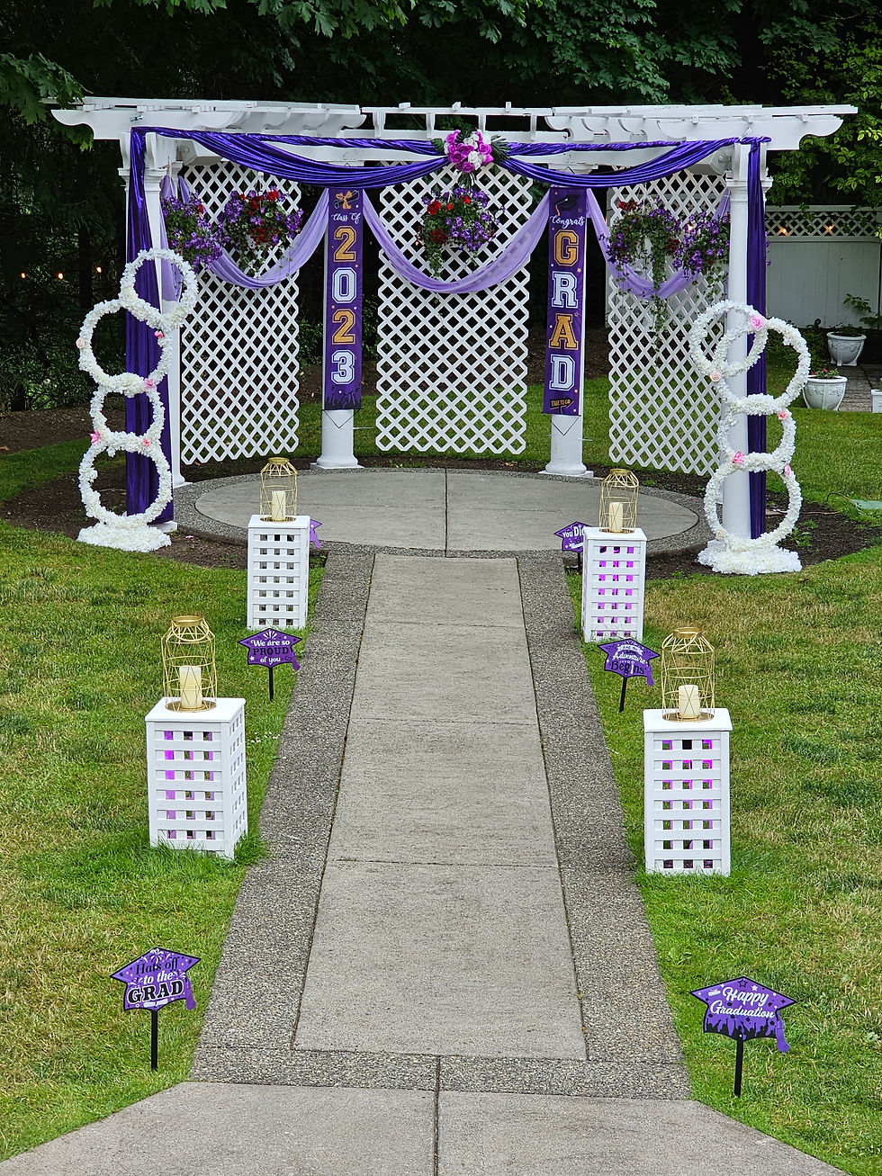 Eye-level view of a beautifully decorated graduation party table with themed centerpieces