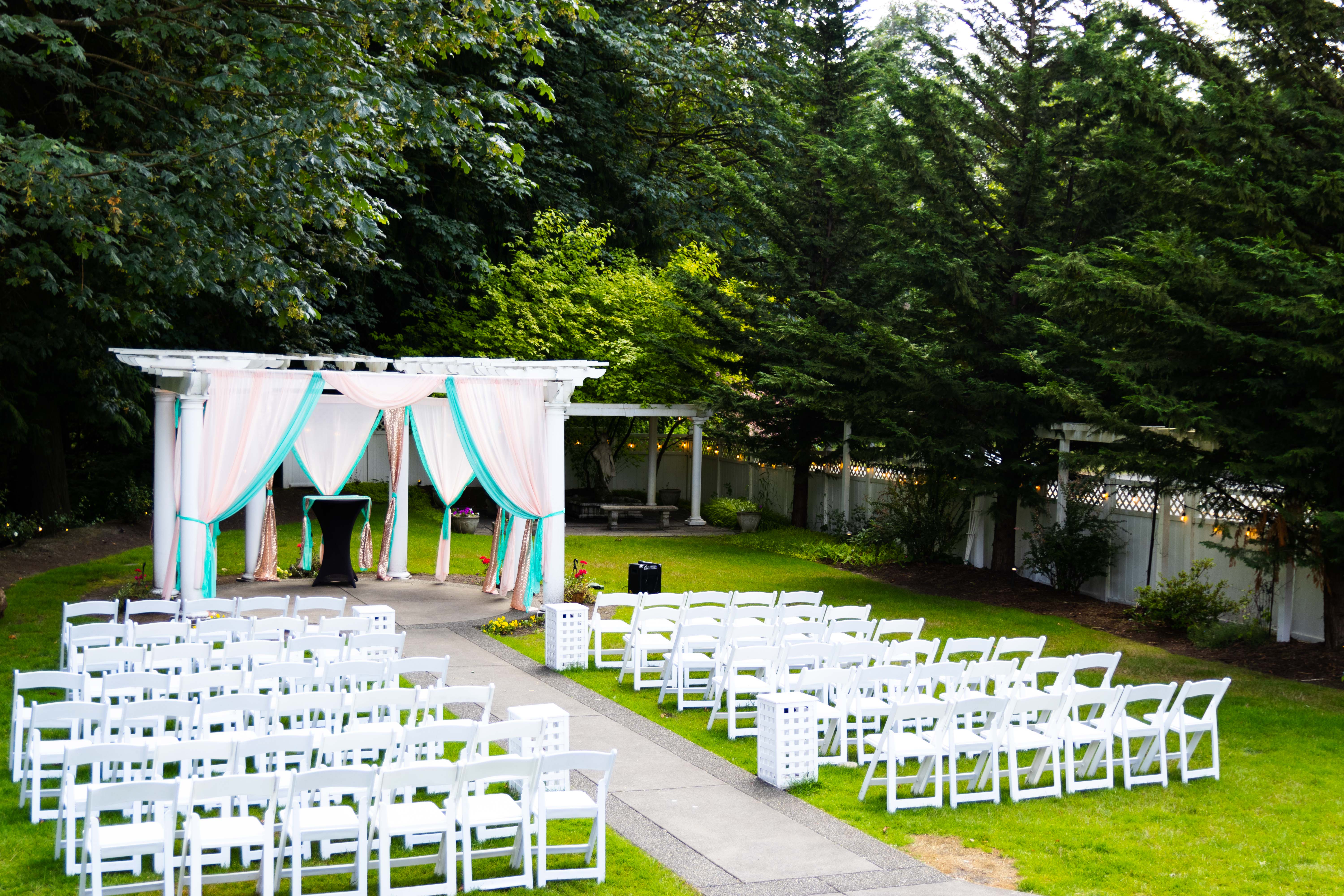 Wide angle view of the elegant outdoor ceremony space at French Creek Manor