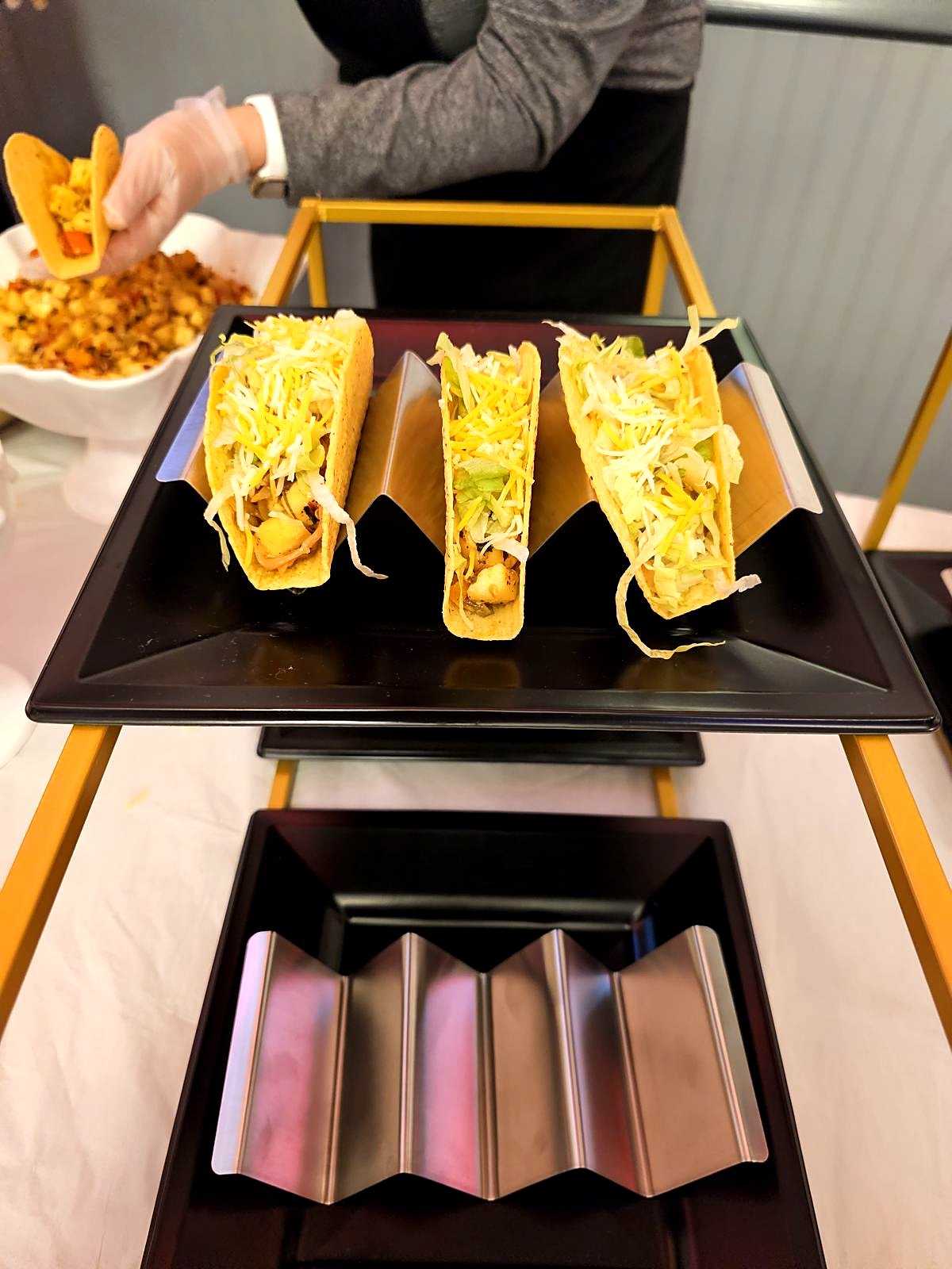 Taco bar served on a gold stand