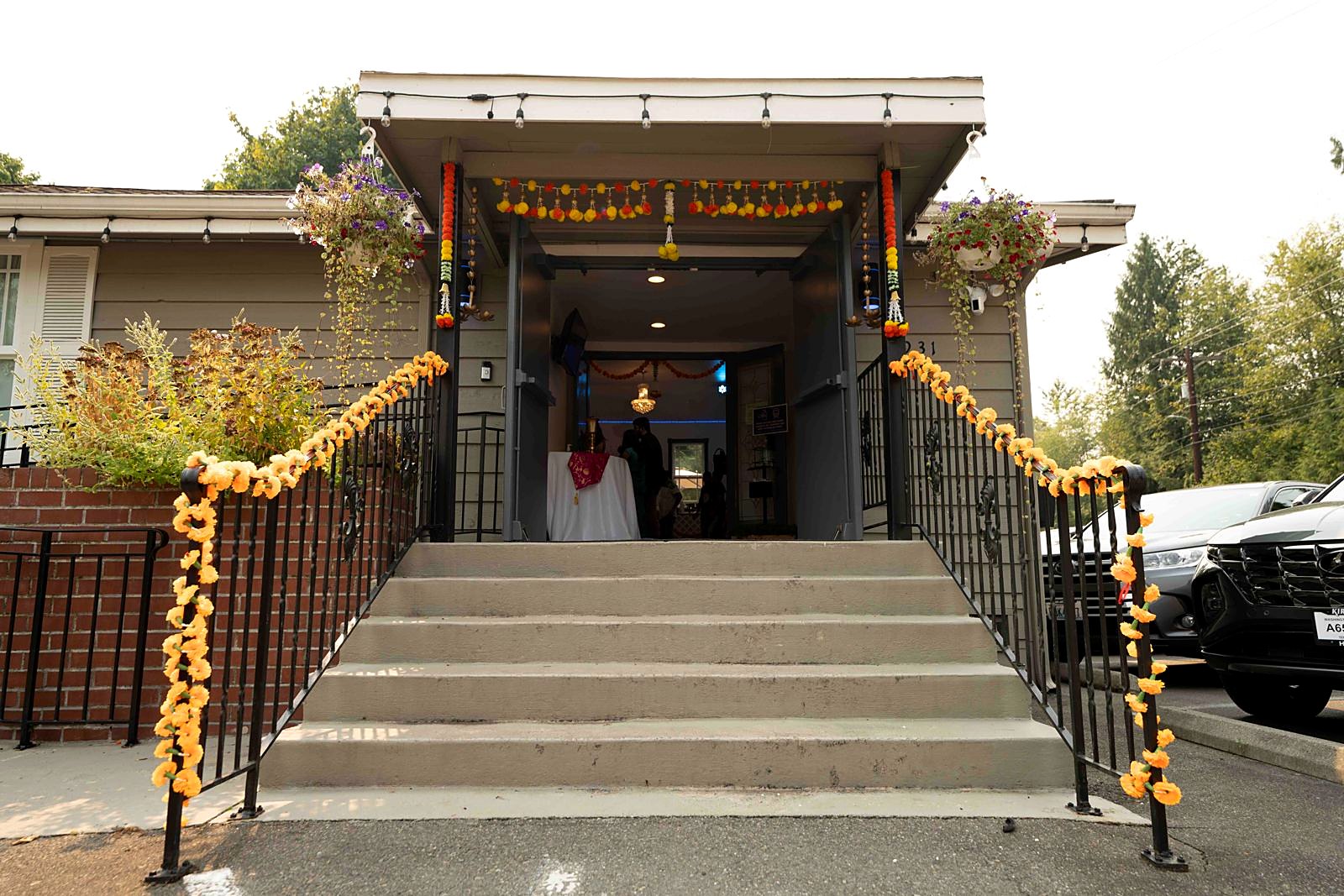 Venue entrance steps decorated with marigold garlands