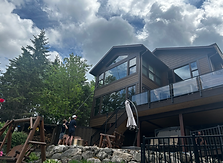 A Lake Vermillion home having its tall windows cleaned