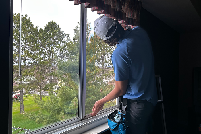 The interior windows of an apartment being cleaned
