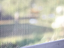 A dirty window screen
