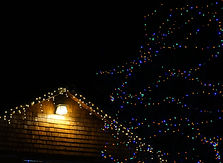 An exterior or a home with a holiday light installation