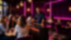 Chic lounge bar with an independent merchant talking to his guests in his premium restaurant.