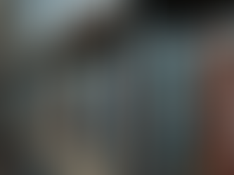 Old DVDs and Blu-rays on a shelf, showing the decline of physical media