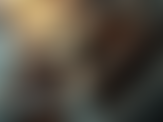 A close-up of a film reel with a film strip unwinding