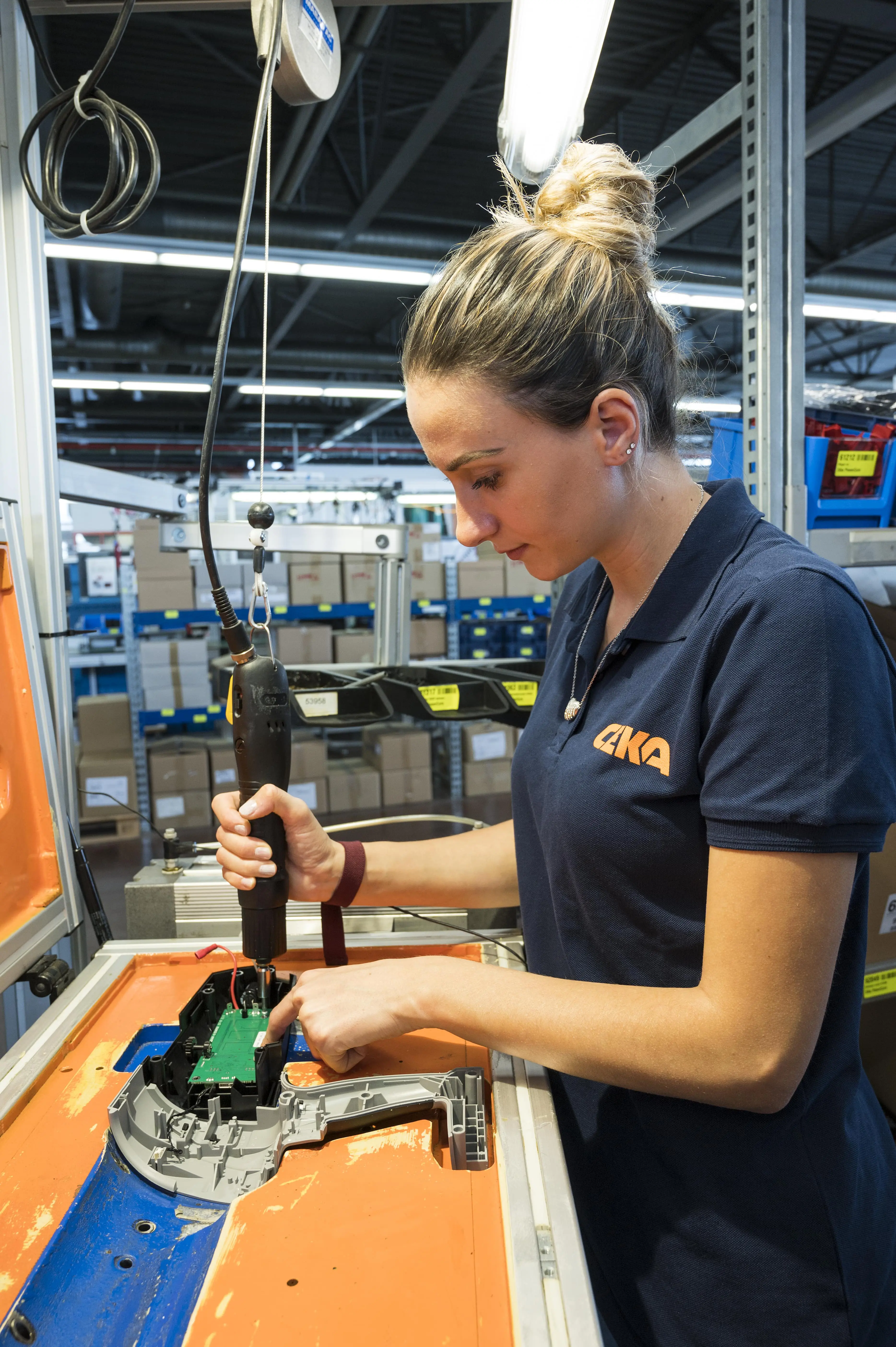 Employee in equipment production, Wattwil, Switzerland