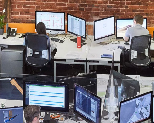 HGP Architects office, showing staff working at computer workstations.
