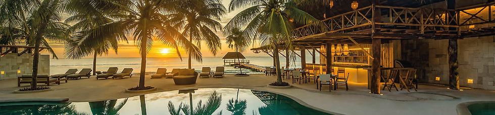 An aerial view of the Viceroy Riviera Maya beachfront and pool area, illustrating the physical scale and operational foundation that must be secured through a professionally managed destination wedding hotel contract.