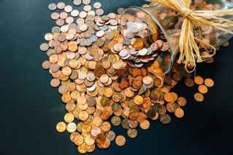 pennies falling from a jar