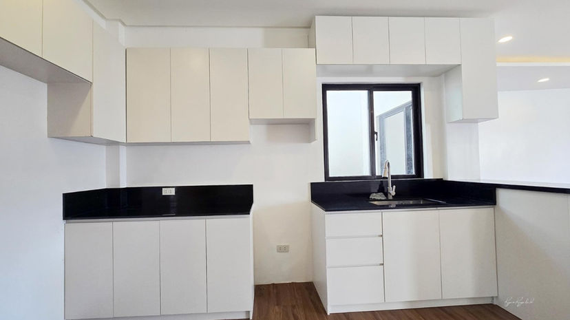 Spacious and well-lit living room with modern finishes in a brand new Las Piñas duplex